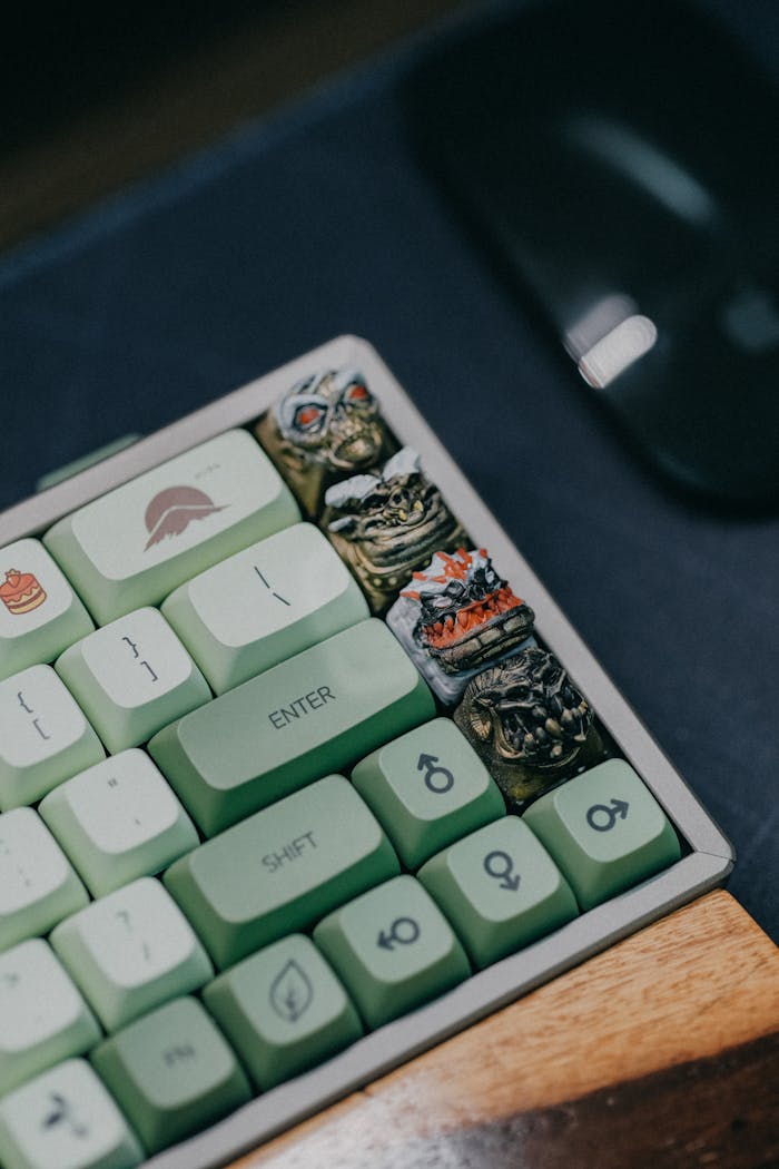 about-01 Close-up of artisanal keycaps on a customized keyboard with a green theme.