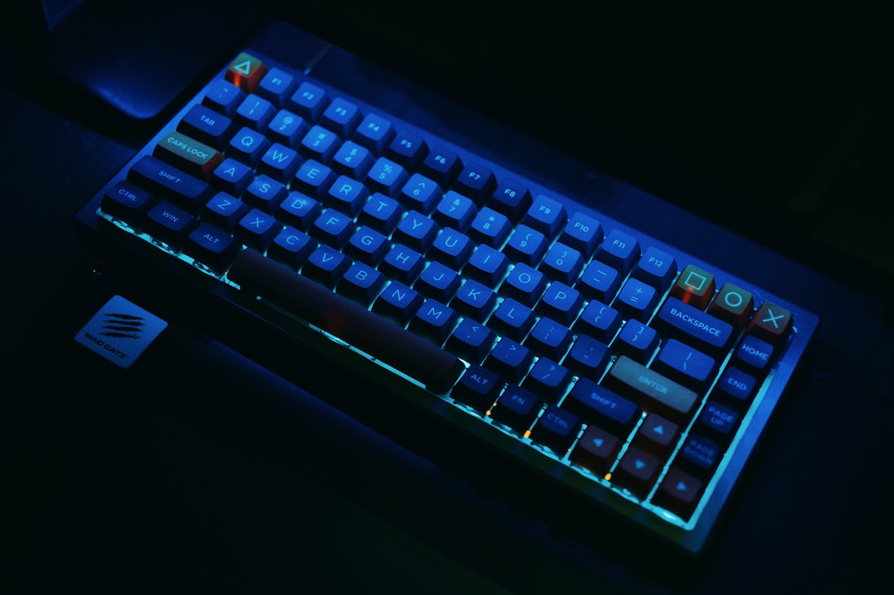 our-services-3 A close-up view of an illuminated mechanical gaming keyboard with RGB lighting.